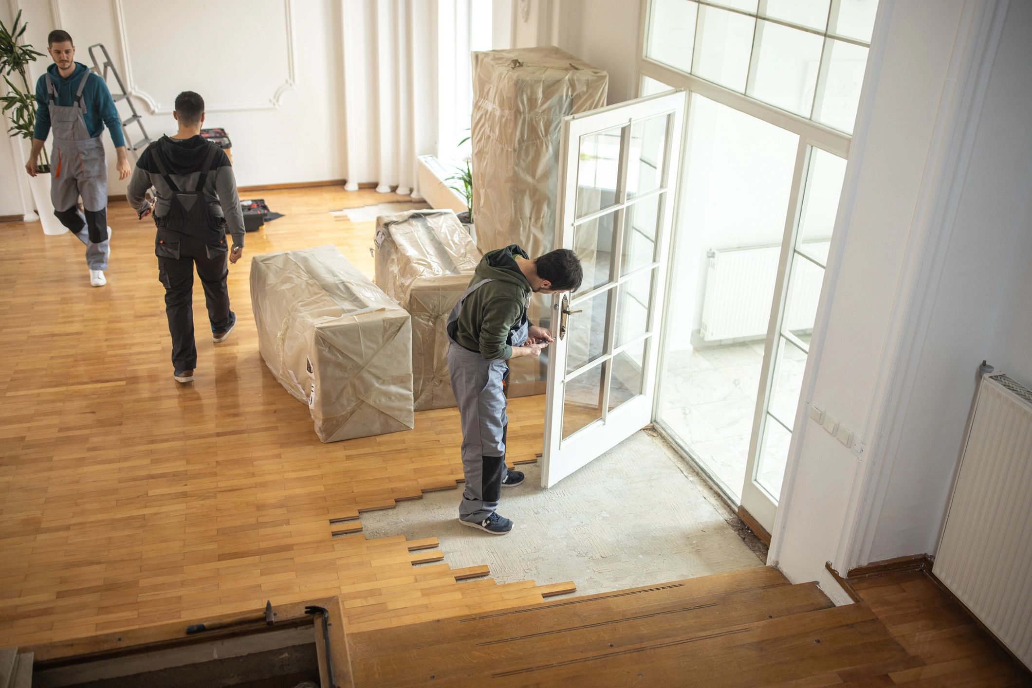 Professional movers handling furniture inside a home