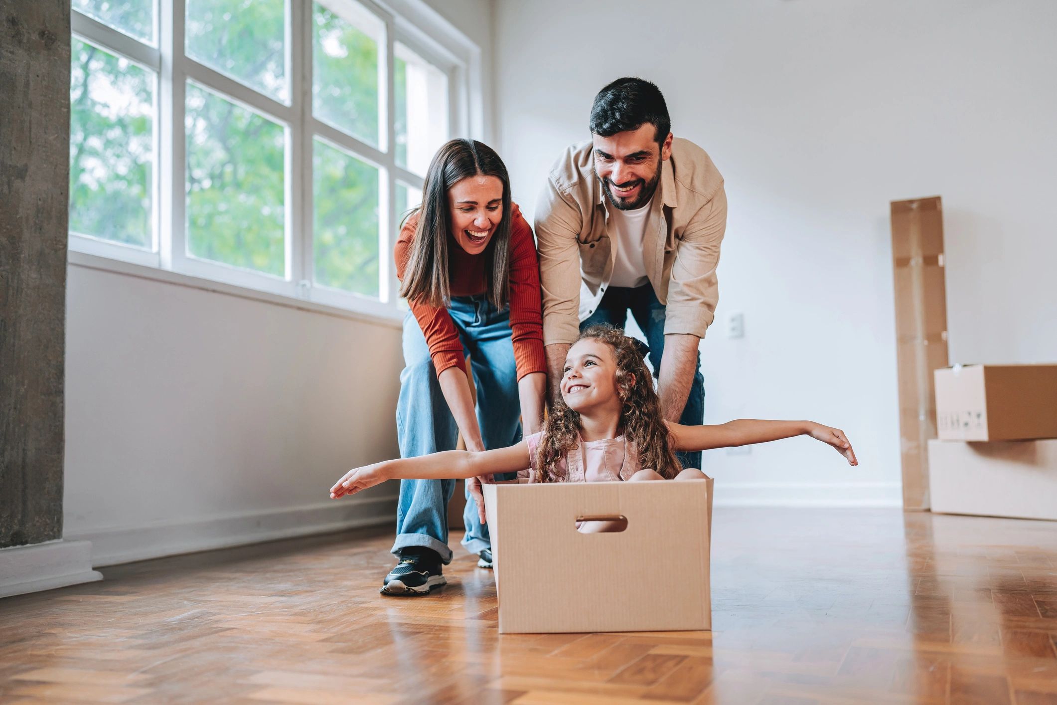 Happy family in a new home after moving